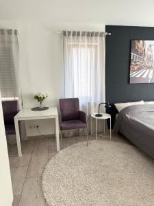 Кровать или кровати в номере Urban City Room Bad Nauheim