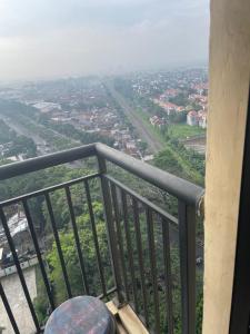 a view of a city from a balcony at Apartemen Tamansari Panoramic amanah in Bandung