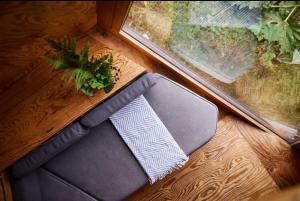 a suitcase sitting on a wooden floor next to a window at Kudhva 3 in Treknow