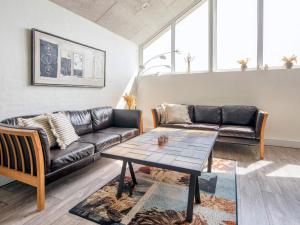 a living room with a couch and a table at 12 person holiday home in Harboøre-By Traum in Harboør