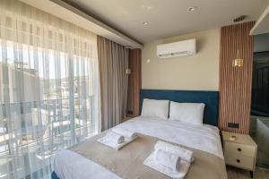 Ένα ή περισσότερα κρεβάτια σε δωμάτιο στο Villa The Bay +10 φωτογραφίες