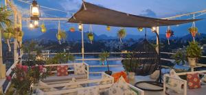 a balcony with a view of a city at Raahi Backpacker's Hostel- Lake View in Udaipur