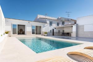 a swimming pool in the backyard of a house at MalagaSuite Villa Nomada El Torcal in Antequera