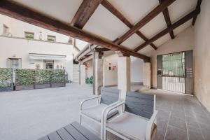 a bench sitting on a patio in a building at Ca' Serena - Murano centro - 10 min from Venice in Venice