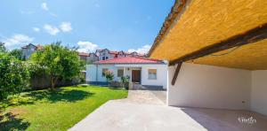 a view of a house with a yard at Holiday Home Leo in Mostar