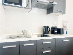 Η κουζίνα ή μικρή κουζίνα στο Pompei - appartement 4 personnes - check in h24 - wifi +8 φωτογραφίες