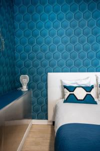 Voodi või voodid majutusasutuse Angoulême, cosy T2 centre ville , TV , WIFI , 4 pers , moderne , parking toas