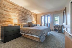 Ένα ή περισσότερα κρεβάτια σε δωμάτιο στο Cozy & Fully-Equipped Apartment in Mont-Tremblant