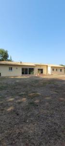 an empty field in front of a building at spacious villa in Saint-Vivien-de-Médoc