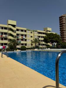 a large swimming pool in front of a building at Calma Mediterránea in Aguadulce