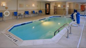 a large swimming pool in a hotel room at TownePlace Suites Wilmington Wrightsville Beach in Wilmington