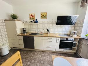 Kuchyň nebo kuchyňský kout v ubytování Ferienwohnung Biederbeck