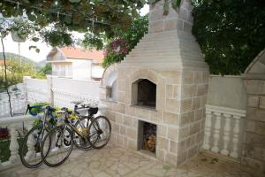 two bikes are parked next to a brick oven at Villa Jelena in Trebinje