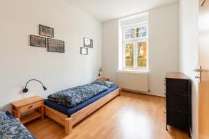 a bedroom with a bed and a window at Am Kanonenberg in Quedlinburg