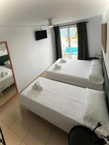 Postel nebo postele na pokoji v ubytování Hostal Blanc Lloret