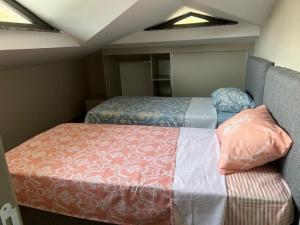 a small room with two beds in a room at Greenpark Villas in Kemer