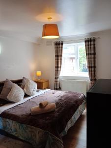 Ένα ή περισσότερα κρεβάτια σε δωμάτιο στο Double room in London