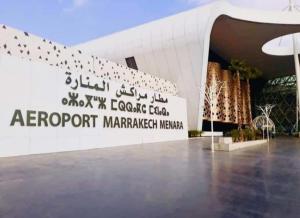 a building with a sign that reads arguri market market mecca at Airport view apartment Marrakech in Marrakesh