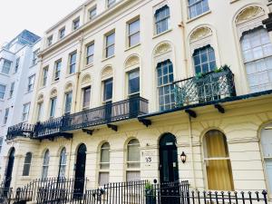 a large white building with windows and balconies at Hangover Hotel - Seafront 8 in Brighton & Hove