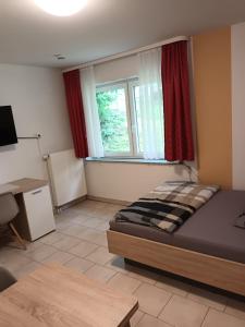 Postel nebo postele na pokoji v ubytování Business Apartment Reutlingen