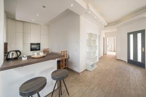 a kitchen with two stools and a counter top at Casa Panoramica - Via Belvedere in Cavallasca