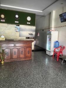 a room with a counter and a refrigerator at hotel đặng hiền lương in Ho Chi Minh City