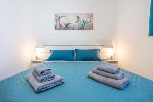 Ένα ή περισσότερα κρεβάτια σε δωμάτιο στο Casa Anna