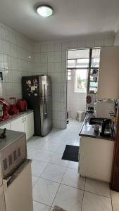 Kuchyň nebo kuchyňský kout v ubytování Quarto entre Centro & Cambuí + 1 fotografie