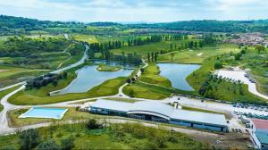 an aerial view of a golf course with a lake at B&B Angelo e Graziella in Monterosi