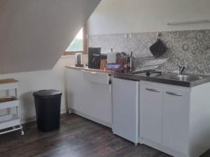 a kitchen with a sink and a counter top at Quiet 2-room apartment in Koenigshoffen in Strasbourg