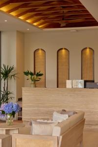 a salon with a wooden ceiling at Ten Boutique Hotel Oldtown Chiangmai in Chiang Mai
