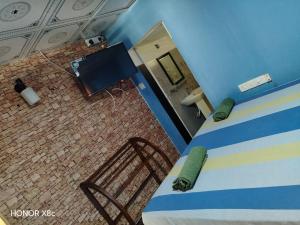 a view of a room with a bed and a bathroom at SA Resort in Anuradhapura