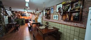 a restaurant with a table and chairs in a room at Casa Quico in Santa Cruz de Tenerife