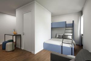 Ένα ή περισσότερα κρεβάτια σε δωμάτιο στο Homaris Nolli Studios