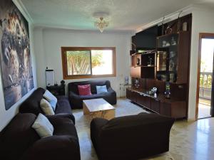 a living room with a couch and a table at Casa Quico in Santa Cruz de Tenerife