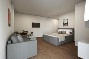 Ένα ή περισσότερα κρεβάτια σε δωμάτιο στο Homaris Nolli Studios +5 φωτογραφίες