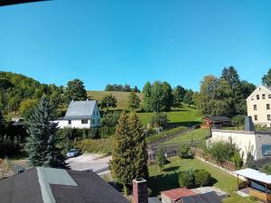 an aerial view of a small town with houses and trees at Himmelsleiter in Schneeberg