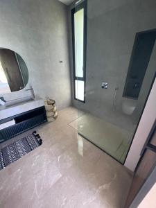 a bathroom with a glass shower and a sink at Villa les palmiers in Marrakesh +42 photos