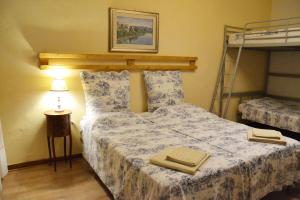 a bedroom with a bed with towels on it at Casa Mortarino in Bozzole