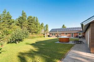 a backyard with a gazebo next to a house at 0181-Romo-Gammel-Skolevej-7 in Kongsmark