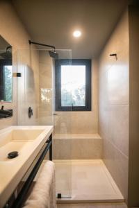 a bathroom with a sink and a shower at Kineki 8 in Brisas de Zicatela +51 photos