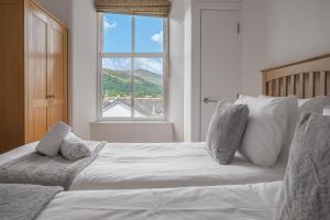 En eller flere senge i et værelse på Chaucer Apartment