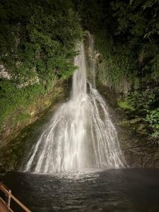 a waterfall in the middle of a body of water at Al Civico32 in Canzo