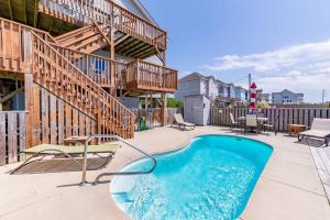 a swimming pool on the patio of a house at K1108 Dream of Jeanne - Semi-Oceanfront, Rec Room, Private Pool in Nags Head