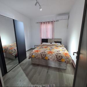 a bedroom with a bed and a large mirror at villa atomium in Midlands Station +14 photos