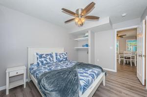 a bedroom with a bed and a ceiling fan at 2 Bedroom Beachside Suite in Clearwater Beach