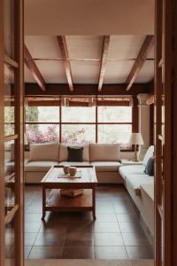 a living room with a couch and a table at Rondaia, a Winery & Fincahotel-Agroturismo in Tramuntana in Valldemossa +219 photos