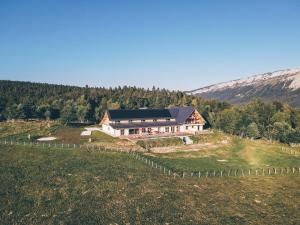 an aerial view of a house on a hill at Chalet de la Villette in Les Déserts