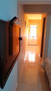 a room with a hallway with a television on a wall at Piedrabuena Yenua1 in Comandante Luis Piedra Buena