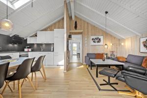 a living room with a couch and a table at 0294-Romo-Vestergade-3-Ap-57 in Havneby
